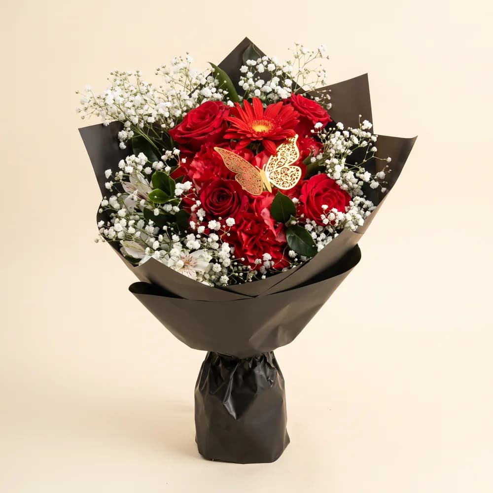 Ramo de rosas rojas y gerberas
